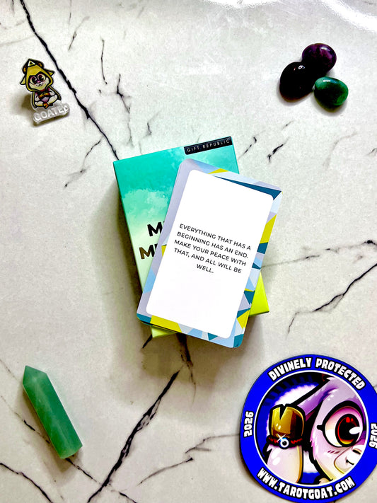A card on a marble table that has the text "Everything that has a beginning has an an end. Make peace with that and all will be well" tip for guided meditation