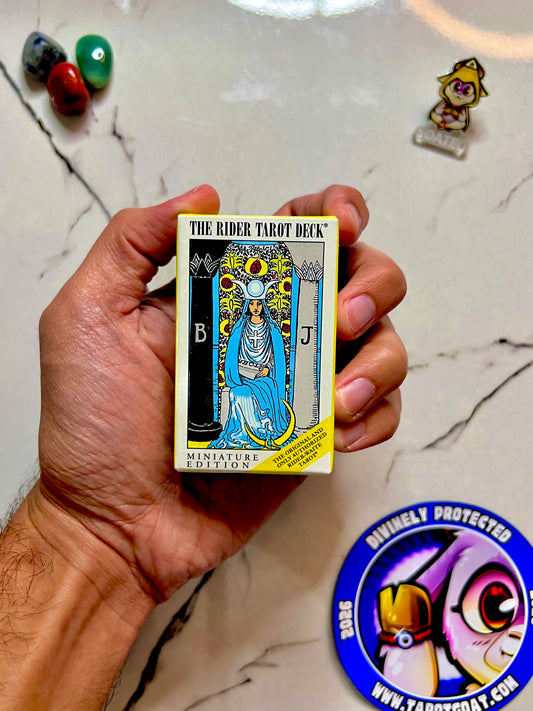 A hnad holding a Tarot Deck Small Sized
