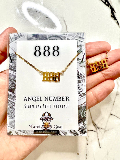 A hand holds a gold stainless steel necklace shaped like the number 888, displayed on its white retail card labeled '888 ANGEL NUMBER STAINLESS STEEL NECKLACE' with the brand 'Tarot Goat'.