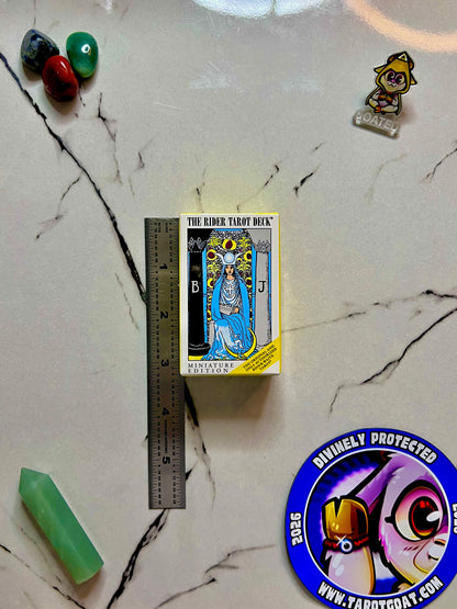 A rider waite tarot deck with a ruler to show that it is a small version measuring 3 inches