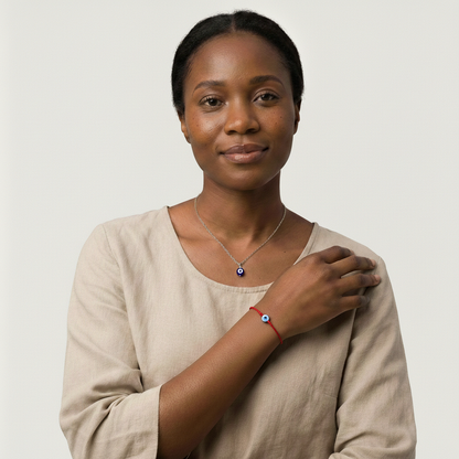 Black Women wearing a stainless steel nazar necklace and an red evil eye bracelet
