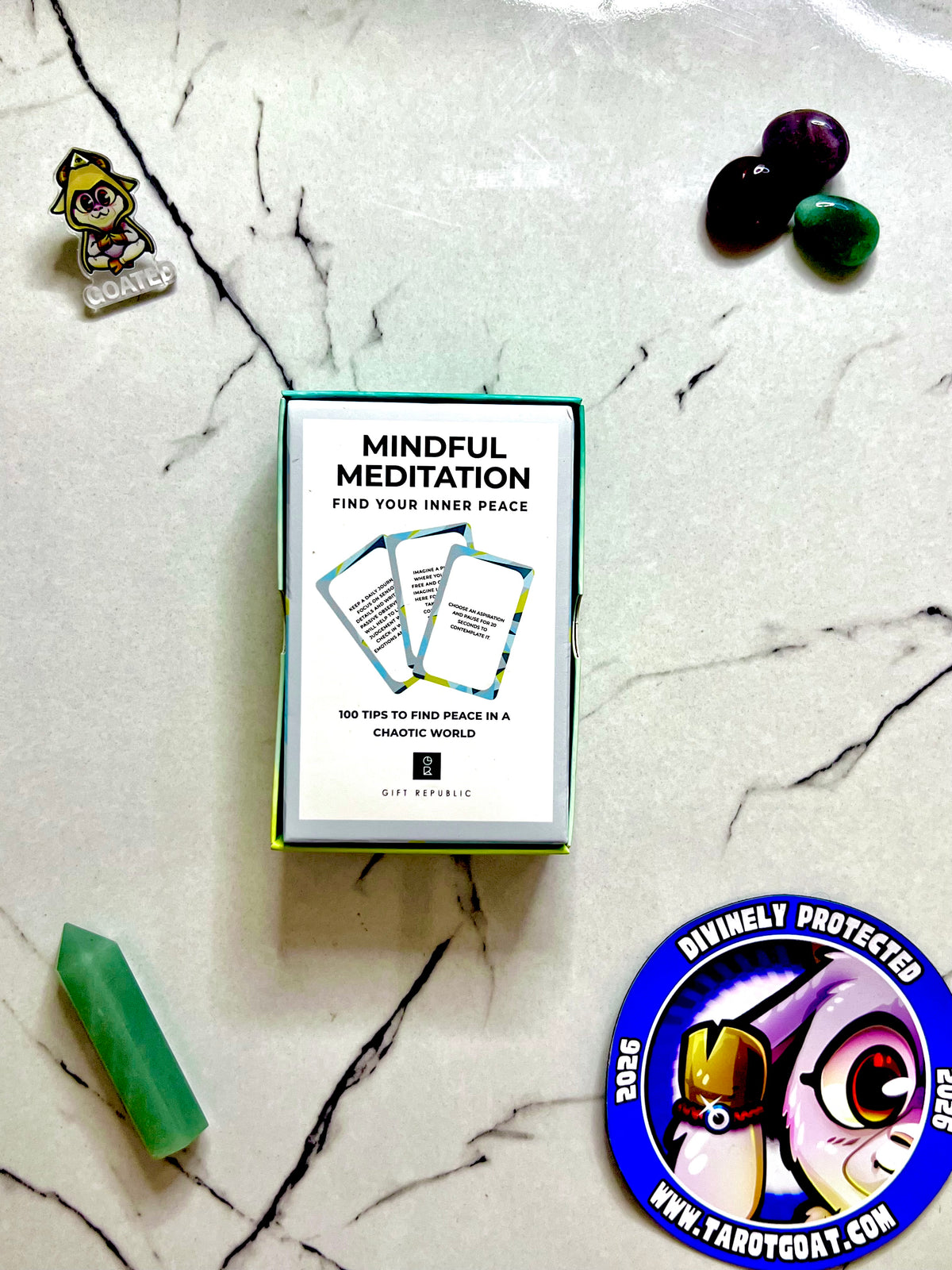 Mindful meditations guided meditation cards for beginners resting on a marble table for display. 