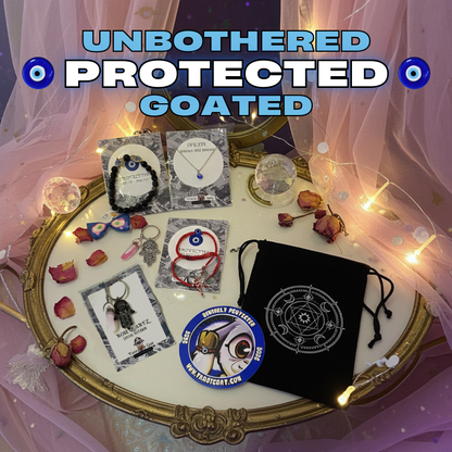Collection of protective  evil eye items including bracelet, necklace, limited edition magnet and a bag on a decorative table with fairy lights.