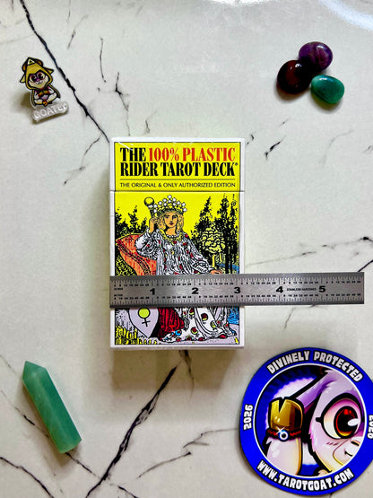  a 100% plastic tarot deck being measured by a ruler on a table with gems and tarot goat magnet