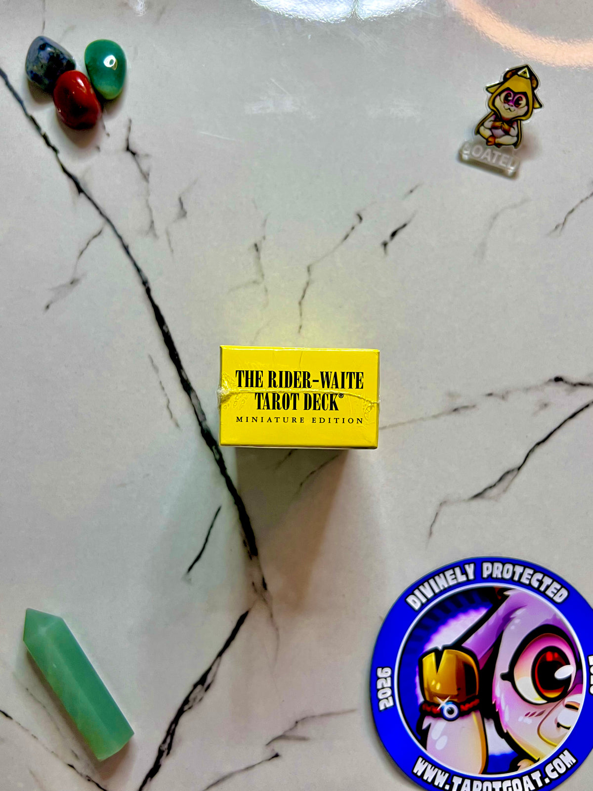The top of a box of a rider waite tarot deck miniature edition