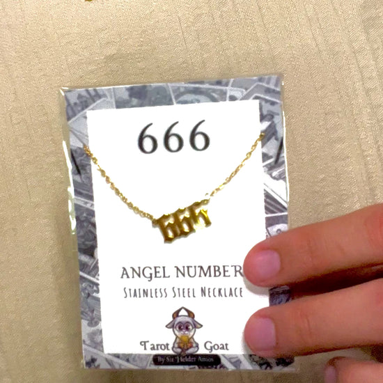 Video of a person showing the 666 pendant from tiktok shop online